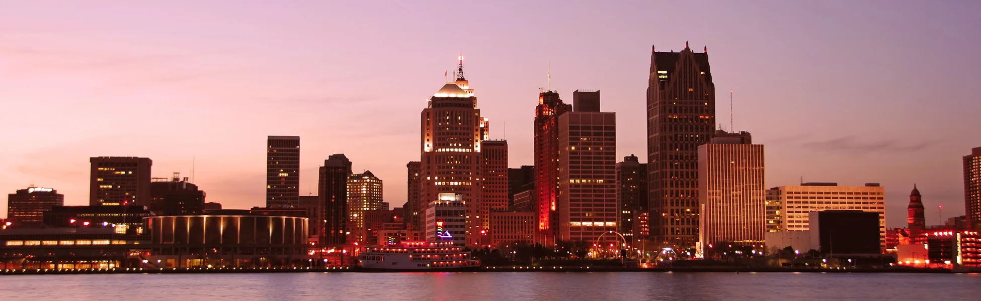 Neon color image of a band playing and people singing along