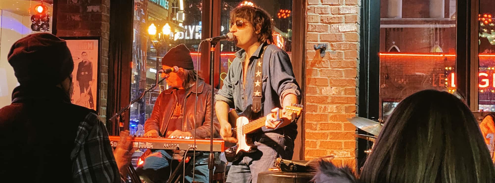 bar singer on guitar in Detroit